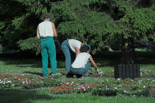 First aider treating a minor wound in a garden setting